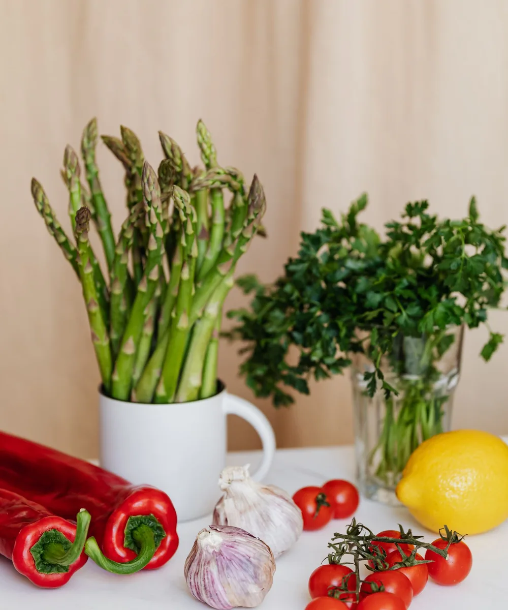 Asparagus, herbs, tomatoes, peppers, garlic, and lemon